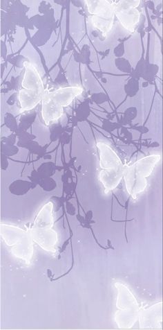 butterflies are flying in the air with purple background