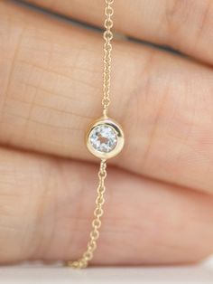 Breathe in the beauty of fall with this beautiful, dainty bracelet that's perfect for everyday wear. This simple piece is crafted from 14K gold, featuring a center stone of your choice. The bezel setting captures the beauty of your chosen stone making this piece perfect for stacking.