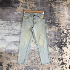 Vintage Levis 550 Jeans Light Wash Levis Denim Pants - BS46510. Manual Measurement (laying in flat area):  1) Waist: 28 inch.  2) Rise: 11 inch.  3) Hips: 19 inch.  4) Tight: 11 inch.  5) Outseam: 39 inch.  6) Inseam: 28.5 inch.  7) Leg opening: 6.5 inch.  Made in: USA.  Fabric Material: 100% Denim Cotton.  Condition: In good vintage condition overall.  Please check all the measurement to insyre a proper fit.  Remember to allow yourself some extra room for movement.  You can compare these inform 90s Style Medium Wash Bottoms, 90s Style Acid Wash Jeans For Spring, 90s Acid Wash Bottoms For Spring, 90s Acid Wash Jeans For Spring, Vintage Washed Blue Pants For Spring, 90s Style Faded Bottoms For Spring, 90s Style Faded Denim Bottoms, Vintage Light Wash Pants For Spring, 90s Style Medium Wash Pants For Spring