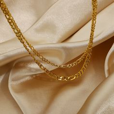 This Layered Gold Figaro Necklace, with its 18k gold-plated layers, brings a sophisticated flair. Its classic Figaro chain design offers timeless elegance, perfect for enhancing both everyday and formal ensembles. Chunky Gold Necklaces, Figaro Necklace, Figaro Chain Necklace, Stacked Necklaces, Layered Chokers, Layered Necklace Set, Daily Jewelry, Senior Prom, Dainty Gold Necklace