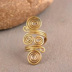 Spiral Brass Ring, Swirl Ring, Gold Wired Ring, Big Spiral Ring, Hypnotic Ring, Boho Ring, Wired Band, Spiral Band Handmade Dainty Ring Size :- All size are available METAL :- Brass ❥ Customers satisfaction is our biggest priority, please contact us with any questions/queries for future or existing orders, and we will do our best to make sure you are happy with your order. ♥ Please Make Sure to Include The Correct Address During Before Order. You Can return Item within 30 Days After Successful Delivery. We Offer 100% Money Back Guarantee If You Not Satisfied With Your Purchase. Return Charge Will Be Paid By Buyer Only. This is my shop link https://www.etsy.com/in-en/shop/AustereGifts?ref=seller-platform-mcnav Thank you🥰 for shopping with us! Bohemian Spiral Wire Wrapped Rings, Jewelry Tutorials Free, Gold Wire Ring, Handmade Copper Bracelet, Diy Wire Jewelry Rings, Wire Jewelry Earrings, Wire Jewelry Rings, Bijoux Fil Aluminium, Medical Jewelry