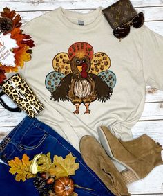 Gobble til you Wobble and add a little fun to your Thanksgiving activities with our Turkey with Leopard Feathers graphic tee shirt! This tee is offered in short or long sleeve options. Makes the perfect Thanksgiving graphic tee! Funny Thanksgiving Shirts Zazzle, Cute Pre-shrunk Shirt For Fall, Cute Multicolor Tops For Fall, Funny Print Long Sleeve T-shirt For Fall, Casual Shirt With Funny Print For Fall, Funny Print Graphic Tee For Fall, Graphic Tee With Funny Print For Fall, Multicolor Graphic Print T-shirt For Fall, Fall Funny Print Short Sleeve Tops