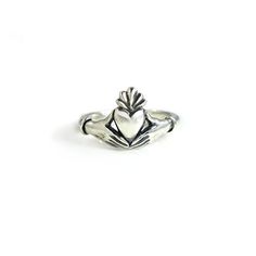 This Claddagh Ring in sterling silver is an original design for my friend Lily's wedding ring. I liked it so much I decided to offer it to others. It is a delicate rendition of the traditional claddagh ring with delicate, feminine hands and wrists. Each wrist wears a single bracelet, opposed to the usual cuff. The hands are fully 3D, and hold the edges of the heart in a realistic way. Oxidized in the crevices to bring out the details, and highly polished throughout. The band measures approximate Classic Sterling Silver Hand Cast Rings, Classic Hand Cast Sterling Silver Rings, Classic Sterling Silver Open Heart Ring, Sterling Silver Heart Ring With Polished Finish For Wedding, Sterling Silver Polished Heart Ring For Wedding, Sterling Silver Heirloom Engraved Promise Ring, Heirloom Sterling Silver Engraved Promise Ring, Hand Cast Sterling Silver Engraved Ring For Wedding, Sterling Silver Heirloom Heart Ring For Promise