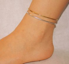 "* AVAILABLE FEDEX EXPRESS SHIPPING UPGRADE 3-5 WORKING DAYS * Handmade ankle bracelet made of brass, aluminium or sterling silver 925 wire and adjustable chain. 7.5 Inches, are adjustable and It has great flexibility to adapt . They are easy and simple to use and can be worn as a compliment to your existing gold or silver pieces or on their own. Each bracelet has a shiny finish for a touch of sophistication. All ingredients used in production are non-allergic. However, due to the fact that ever Adjustable Gold Minimalist Anklet, Adjustable Minimalist Gold Anklet, Adjustable Sterling Silver Bracelet Anklets, Minimalist Metal Anklets For Gift, Minimalist Metal Anklets As A Gift, Minimalist Metal Anklets Perfect For Gift, Gold Minimalist Handmade Anklet, Adjustable Hypoallergenic Sterling Silver Anklets, Minimalist Handmade Gold Anklets