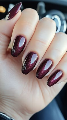 Get noticed at homecoming with Deep Sparkly Plum nails! This rich, shimmering shade adds a touch of luxury and sophistication. Click the pin and follow us for more dazzling nail design ideas! #DeepPlum #HomecomingNails #NailArt #SparklyNails #GlamNails Plum Nails With Glitter, Plum Sparkle Nails, Burgundy Chrome Nails Designs, Maroon Nails With Design, Deep Plum Nails, Plum Fall Nails, Plum Nail Designs, Plum Nails With Design