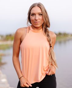 The Peach Tie Back Halter is ready for whenever you are. Made with polyester-spandex blend fabric, it's lightweight and breathable. Cut with high halter top neckline and a cute wrap around in the back, style is at the heart of this sweet and sporty tank. 🍑