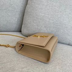 Size: 20cm*12.5cm*5cm It comes with Dust box, Care manual, Tag, and Paper bag. Rectangular Tan Shoulder Bag With Dust Bag, Tan Rectangular Shoulder Bag With Dust Bag, Office Beige Shoulder Bag With Original Box, Tan Rectangular Shoulder Bag, Elegant Tan Box Bag With Dust Bag Included, Designer Rectangular Box Bag With Chain Strap, High-end Beige Bag For Gift, High-end Beige Rectangular Flap Bag, Designer Beige Rectangular Case Bag