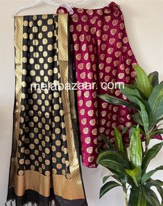 Soft and flowy Banarsi satin silk lehenga/skirt with a big flare and a coordinating Banarsi dupatta. Skirt length: 40 inches. Skirt waist: fits up to 38 inches. Dupatta: 96 by 34 inches. Color: Black and Wine Traditional Anarkali Satin Dupatta, Anarkali Satin Dupatta, Traditional Satin Sets With Dupatta, Party Dupatta With Cutdana In Katan Silk, Anarkali Style Saree With Traditional Drape In Satin, Party Katan Silk Dupatta With Cutdana, Traditional Satin Choli With Dupatta, Traditional Drape Semi-stitched Skirt For Festivals, Semi-stitched Satin Sharara For Festive Occasions