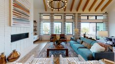 a living room filled with furniture and a fire place next to a wall mounted tv