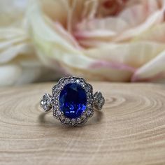 Oval Cut Blue Sapphire Engagement Ring 14k White Gold For Women Unique Vintage Halo Blue Sapphire Promise Ring, Halo Blue Sapphire Ring 6309 #OvalCut #BlueSapphireRing #14kWhiteGold #VintageRings #HaloRings #PromiseRing #BlueSapphire #UniqueRings #ForWomen #EngagementRings Formal Blue Sapphire Ring Gia Certified, Classic Blue Halo Ring, Blue Oval Cluster Ring With Accent Stones, Classic Blue Cluster Ring With Halo, Blue Cluster Ring With Prong Setting For Anniversary, Blue Sapphire Cluster Ring With Halo Design, Classic Blue Sapphire Diamond Ring, Oval Gemstone Rings In Royal Blue, Royal Blue Oval Gemstone Rings