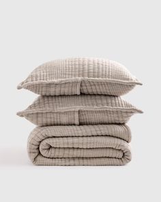 three pillows stacked on top of each other