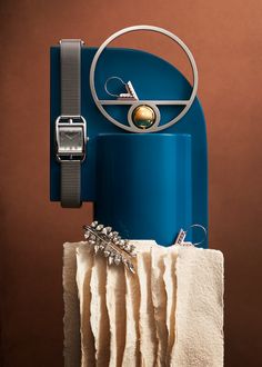 a blue ice chest sitting on top of a white towel next to a brown wall