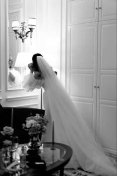 the bride is getting ready to walk down the aisle in her wedding dress and veil