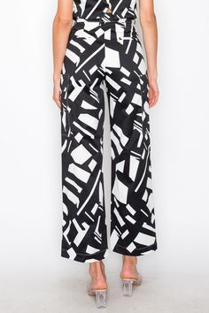 - SKU: P2125- S-M-L-The high waistband is crafted from a lightweight white fabric that contrasts beautifully with the geometric pattern, creating a visually captivating look.-The breathable and soft fabric ensures all-day comfort, making these pants suitable for various occasions.- These pants come complete with two side pockets, adding a practical element to their design without compromising on aesthetics. White High-waisted Wide Leg Pants, Modern White High-waisted Wide Leg Pants, Modern White Straight Pants, Chic Summer Bottoms With Geometric Pattern, Wide Leg Bottoms With Geometric Pattern For Spring, White Printed Wide Leg Pants, Modern Bottoms With Elastic Waistband, Modern White Trousers, High Waist Printed White Pants