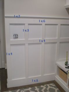 an image of a white closet with measurements for the door and bottom paneled wall