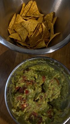 two bowls filled with guacamole and chips