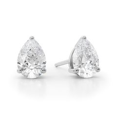 Perfect your everyday look with the timeless sparkle of these luxe pear-shaped diamond solitaire stud earrings in white gold. Crafted in 14K white gold Each earring showcases a 1/2 ct. pear-shaped diamond solitaire. Dazzling with 1 ct. t.w. of diamonds These post earrings secure comfortably with friction backs. White Pear-shaped Diamond Earrings, White Brilliant Cut Pear Shaped Diamond Earrings, White Pear-shaped Diamond Earrings Fine Jewelry, White Pear-shaped Diamond Earrings With Brilliant Cut, White Pear-shaped Brilliant Cut Diamond Earrings, Pear-shaped Diamond Earrings With Accents, White Brilliant Cut Teardrop Earrings, Pear-shaped Brilliant Cut Diamond Earrings, White Brilliant Cut Pear Teardrop Earrings