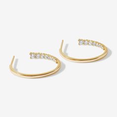 Say hi to your hot new hoops. Bentley's unique hoop design, with graduating crystal claws lining the inside of hoop, keeps you looking stylish from every angle. We love these earrings styled with a slick back ponytail and a winged eyeliner. Utilizing a luxury 14 karat gold plating over a solid sterling silver base, these Adorn Luxe earrings have a beautiful 'demi-fine' jewelry finish. Chic Cubic Zirconia Hoop Earrings, Chic Hoop Earrings With Cubic Zirconia, Small Hoop Diamond Earrings With Accents, Everyday Hoop Earrings With Diamond Accents, Minimalist Hoop Earrings With Diamond Accents, Modern Small Hoop Earrings With Diamond Accents, Small Hoop Earrings With Diamond Accents For Everyday, Everyday Small Hoop Earrings With Diamond Accents, Everyday Small Hoop Earrings