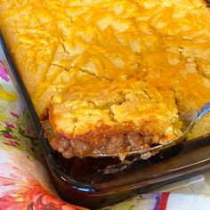 a casserole dish with meat and cheese on it, ready to be eaten