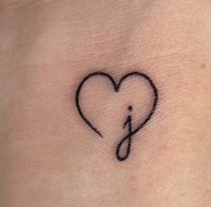 a heart with a musical note tattoo on it