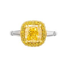 3 stone ring in 18K Yellow Gold & PT950 Center stone: 2.29ct Natural Fancy Yellow Even VVS2 Cushion Shape Diamond GIA#5222222141 Side stones: 0.36ct G VS tapered baguettes Total Carat Weight pave Yellow: 0.28ct Total Carat Weight pave pave White: 0.24ct Size: 6 Comes with GIA certificate, appraisal available upon request Retail Value: $55,000 Gia Certificate, 3 Stone Rings, Cushion Cut, Three Stone Rings, Three Stone, Stone Rings, Diamond Jewelry, Heart Ring, Yellow Gold