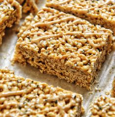 some kind of food that is on top of a piece of parchment paper with peanut butter