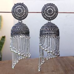 Fancy Party Wear Traditional Earrings. Perfect with ethnic & traditional wear. Perfect gift for any occasion for yourself and your dear ones. It is advisable to store jewellery in a zip lock pouch (air tight pouch), keep away from water perfume and other chemicals and clean it with dry and soft cloth. Dangle Earrings For Eid Party, Heavy Silver Chandelier Earrings For Festivals, Silver Heavy Chandelier Earrings For Festivals, Navratri Drop Earrings For Pierced Ears, Navratri Drop Danglers For Pierced Ears, Heavy Dangle Jhumkas For Diwali, Traditional Festive Danglers For Pierced Ears, Festive Chandbalis For Navratri With Pierced Ears, Festive Navratri Chandbalis With Pierced Ears