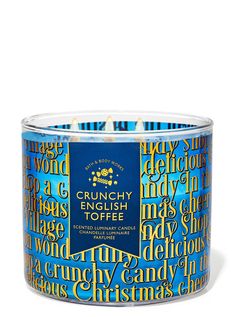 a blue and yellow candle with the words crunchy toffee printed on it