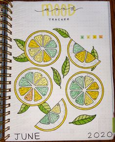 a spiral notebook with lemons and leaves on it