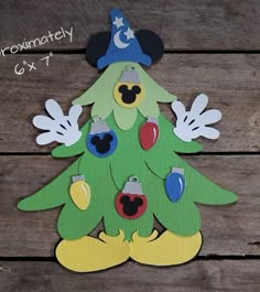 mickey mouse christmas tree cutout on wood