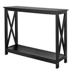 a black console table with an x design on the top and bottom shelf, against a white background