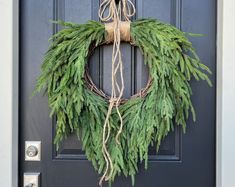 a wreath is hanging on the front door