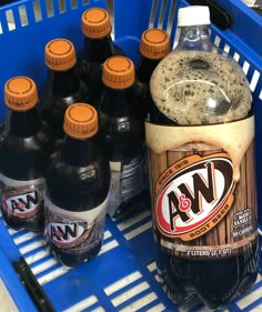 several bottles of soda sit in a grocery basket