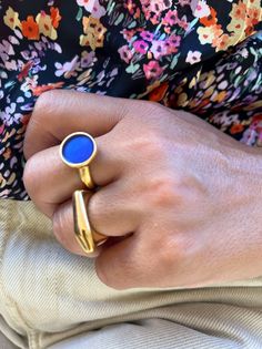 Discover the exquisite collection of handcrafted gold rings at Christina Christi Store on Etsy.com. Embrace elegance and uniqueness with our stunning designs. The first ring showcases a mesmerizing round shape with enchanting blue enamel, while the second ring boasts a sleek solid bar design. Both versatile pieces are slightly adjustable for a perfect fit. Shop now and adorn your fingers with these exclusive treasures from Christina Christi Store. 👉 My Rings Collection: https://etsy.me/2z6Fby0 Elegant Adjustable Gold Enamel Ring, Gold Enamel Open Ring, Luxury Gold Sapphire Open Ring, Luxury Gold Open Sapphire Ring, Modern Gold Stackable Gemstone Rings, Modern Gold Stackable Rings With Gemstones, Modern Stackable Gold Rings With Gemstones, Modern Gold Dome Ring With Bezel Setting, Gold Open Sapphire Ring