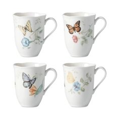 four coffee cups with butterflies painted on the sides and flowers in the middle, set of 4