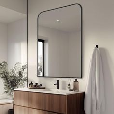 a bathroom with a sink, mirror and bathtub