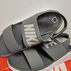 Nike Womens Tanjun Sandals Sz 12 Gray Nike Benassi Slides, Floral Nikes, Pink And Black Nikes, Nike Flip Flops, Logo Flip Flops, Nike Sandals, Nike Benassi, Nike Slides, Nike Tanjun