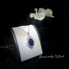 "Large Blue Sapphire Jewelry High Quality unique Artisan design full sterling silver made Gorgeous Luxury Gemstone Dainty Necklace best gift for yourself & you loved her. ◆◆Pendant Main stone:18*13mm Created Blue Sapphire Pendant Height ( include bail) : 41mm Pendant Holder (bezel & Bail) : White Gold Coated 925 Sterling Silver Accent Stone: Sim Diamond ◆◆ Necklace chain : Platinum coated 925 sterling silver Box Chain with length option from 16\" ~20\". The model wearing the default size Luxury Tanzanite Necklace For Anniversary, Luxury Tanzanite Necklaces For Anniversary, Exquisite Sapphire Necklaces, Formal Necklace With Oval Pendant And Accent Stones, Formal Oval Pendant Necklace With Accent Stones, Exquisite Sapphire Necklace, Formal Oval Necklace With Accent Stones, Elegant Round Royal Blue Jewelry, Formal Royal Blue Sterling Silver Jewelry