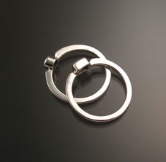 "Set of two Sterling Silver rings with your choice of premium natural birthstones.(restrictions apply). Size and shape can vary (triangle, round, oval, and square). Stones are between 3.5 and 4.5mm. Two rings are about 4mm wide at the bottom and 6mm at the top. Specify ring size and birthstone preference in a \"note to seller\" at check-out. It is always best to send me a note before ordering to work out the details." Modern Sterling Silver Stackable Rings Round Cut, Modern Oval White Gold Stackable Rings, Modern Stackable Rings With Tension Setting For Gift, Modern Stackable Rings With Tension Setting As Gift, Modern Sterling Silver Stackable Rings For Promise, Modern Sterling Silver Stackable Rings With Tension Setting, Modern Sterling Silver Solitaire Rings, Modern White Gold Ring With Birthstone, Modern Stackable Birthstone Rings Round Cut