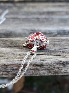 This heart locket necklace is perfect for anyone! It is silver with red enamel and a scrolling silver design on the top. It has a little hook on one side and it can be opened up and you can put whatever you want inside. It's about 4 mm deep inside x 14mm wide. These would be great for any time of the year! This is a wonderful gift for a wedding, bride or bridesmaid gift, for a Christmas gift, for Mother's Day, or a birthday. This listing is for one chain and pendant. Red Heart-shaped Engraved Jewelry, Red Engraved Heart-shaped Jewelry, Personalized Red Jewelry For A Gift, Personalized Red Jewelry For Gift, Personalized Red Jewelry Gift, Heart Charm Locket Necklace Gift, Valentine's Day Heart Pendant Locket Necklace Gift, Valentine's Day Locket Necklace As Gift, Valentine's Day Gift Locket Necklace