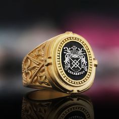 Gold Coated Family Crest Ring Gift, Raised Family Celtic Ring, Coat of Arms Ring, Personalized Signet Ring, Customized Ring, Crest Ring Gift Product Details: ✅Material: 925 Sterling Silver, Gold Coating,  Black Rhodium Coating ✅Ring Size: Available in various sizes (please refer to our sizing chart) ✅Handmade with exceptional craftsmanship ✋🎨 ✅ Dimensions:  21x19mm   /   ±14gr 🛡️ Discover our custom coat of arms jewelry, a symbol of heritage made uniquely yours! 🌟💍 Choose your family crest and let us bring it to life with expert craftsmanship. 🖌️✨ Our artisans create stunning pieces in silver, gold coating, or rhodium coating, tailored to your preferences. 💫🔒 With attention to detail and a touch of elegance, our jewelry collection includes signet rings, pendants, and bracelets, each Luxury 14k Stamped Collectible Signet Ring, Fine Jewelry Rings With Certificate Of Authenticity As Gift, Classic Engraved Enamel Ring For Anniversary, Classic Engraved Enamel Ring For Formal Occasions, Luxury Ceremonial Engraved Ring With Polished Finish, Luxury Engraved Enamel Ring For Formal Occasions, White Gold Rings With Certificate Of Authenticity For Gift, Luxury Ceremonial Rings With Engraving Option, Custom Oval Hallmarked Signet Ring