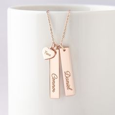 "This beautiful grandma necklace is engraved with your children's names on each charm. It's a perfect gift for your loved one with up to 5 personalized charms. PRODUCT INFO * Material: Solid 925 Sterling Silver * Dimensions: Bar charm measures ~ 1 1/4\" x 1/4\" (32 x 6.5mm). Heart charm measures ~3/8\"x5/16\" (9.5 x 8.2mm) * Word limits: 1 name/charm * By default, silver charm comes with BLACK engraving and gold-plated charm comes with CLEAR engraving HOW TO ORDER * Select your preferred finishi Personalized Rose Gold Name Necklace, Rose Gold Name Necklace For Birthday And Valentine's Day, Engraved Name Necklace For Father's Day, Personalized Necklaces For Father's Day Gift, Personalized Necklace For Father's Day Gift, Name Necklace Gift For Mom, Engraved Name Necklace For Father's Day Anniversary, Engraved Name Necklace For Anniversary And Father's Day, Personalized Charm Necklaces For Father's Day Gift