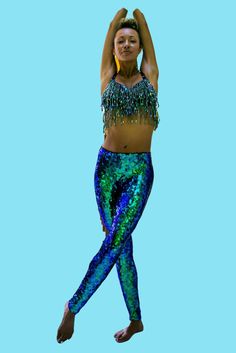 Mermaid disco sparkle pants for Women and Men. Our custom made sequin leggings are made by hand-sewing each sequin and a tiny bead individually. It's the only way to ensure the material will stretch and fit exactly around your legs and curves. Made for maximum visual impact, total comfort, and durability, these are a statement piece for your festival / rave / party wardrobe. A festival dream outfit, also suitable for professional pole dancers, circus performers, dancers and costume makers. And, Green Sequined Party Bottoms, Fitted Green Bottoms For Party Season, Glamorous Green Sequined Bottoms, Stretch Green Leggings For Night Out, Green Stretch Leggings For Night Out, Party Sequin Stretch Leggings, Fitted Sequin Bottoms For Dance, Sequin Bottoms For Festival And Party Season, Green Sequin Party Pants