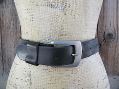 90s KENNETH COLE thick black leather belt with silver tone buckle. All leather. The buckle is made in Italy. The belt is handcrafted in Argentina Label size is 36 Please compare hole placement to a belt that fits you well   Holes at 36 to 40" mark, measured from prong to first and last hole Width is 1-1/4" Good vintage condition with light signs of use and age such as a few scuffs to leather and some subtle softening of leather Black Leather Belt, Leather Trousers, Suspender Belt, Kenneth Cole, Suspenders, Leather Belt, Black Leather, Buckle, Bathing Beauties