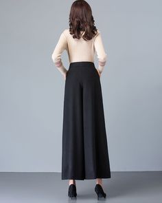 * A simple wide leg pants for winter, made of quality wool blends. * Two pockets, they are big enough for Iphone and your hands. * Fixed waist with zipper and button. * Material: 50% wool, 50% polyester; lining-100% polyester * Washing instructions: Dry Clean Only * Let us know your usual size in your country and your overall height. * Can custom make waist size and length. * Size: True to US size, US 0-US 20 are available, you can let us know your usual size and height in your order. * Shipping Black Wide Leg Full Length Pants For Fall, Black Baggy Wide Leg Pants For Winter, High-waisted Black Wide Leg Pants For Winter, Black Full-length Dress Pants For Fall, Solid Wide Leg Winter Pants, Solid Color Wide Leg Winter Pants, Solid Wide Leg Full Length Pants For Fall, Solid Color Full Length Wide Leg Pants For Fall, Black Wide Leg Dress Pants For Fall