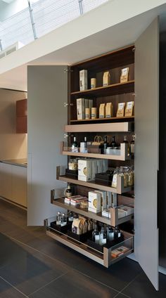 the shelves in this kitchen are filled with different types of spices and condiments