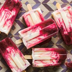 several popsicles with red and white toppings on them