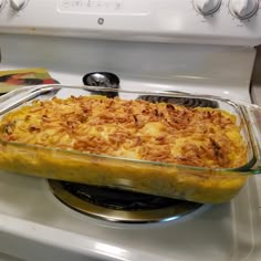 a casserole dish sitting on top of a stove