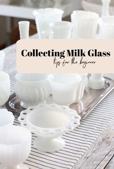 a table topped with lots of white dishes