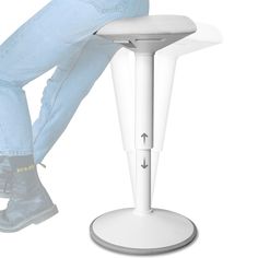 a person sitting on a stool with their feet up